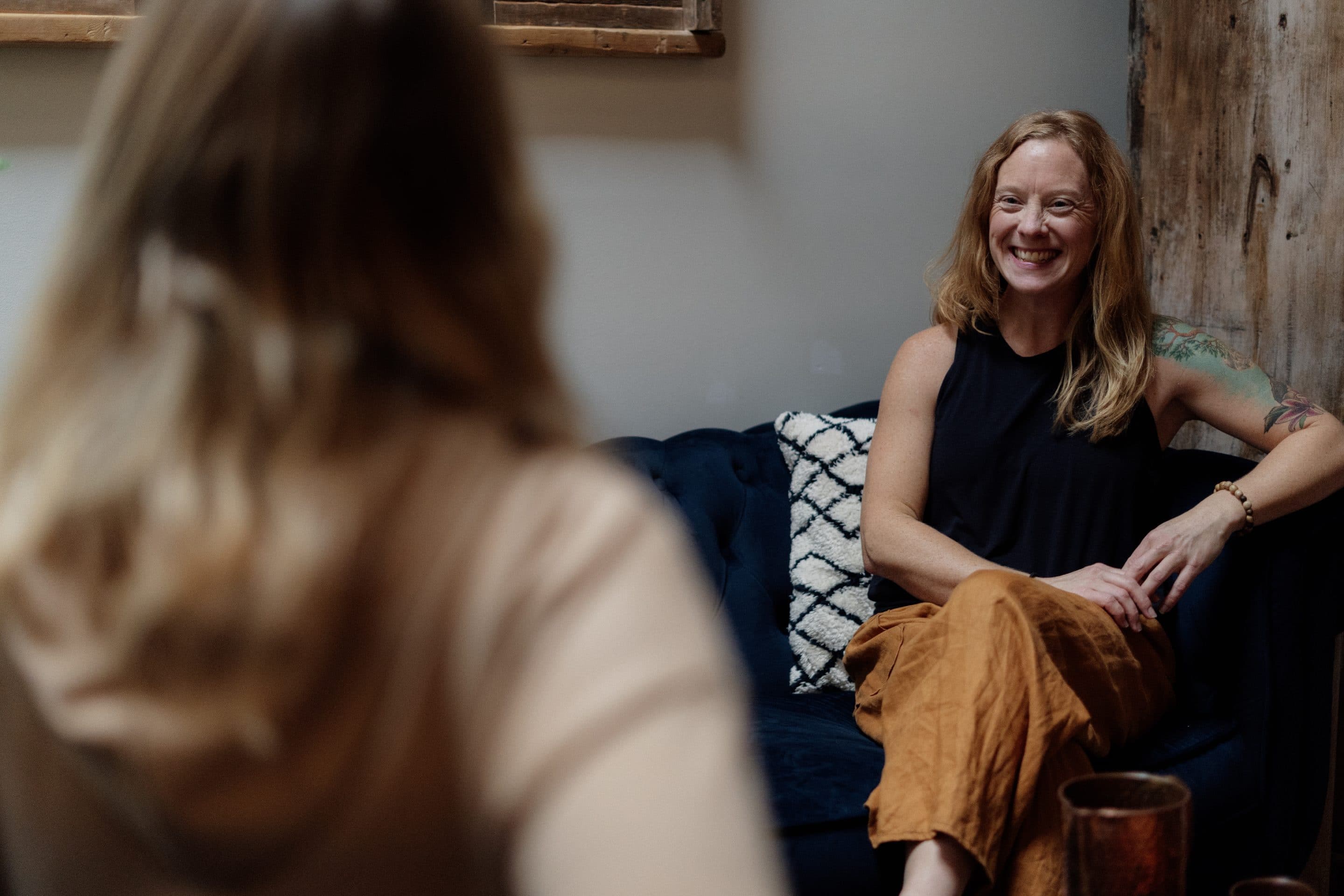 Holistic Nutrition Consultation at MA Wellness and Yoga Woman receiving a holistic nutrition consultation in a calming wellness studio setting.