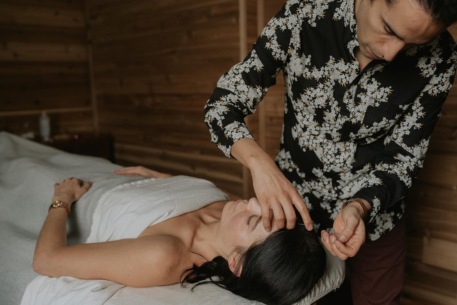 Professional Acupuncture Services in Victoria - Patient Care and Wellness Experienced acupuncturist in Victoria performing a precise acupuncture treatment on a patient.